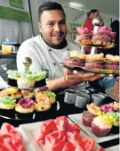  ?? Picture: EUGENE COETZEE ?? LET’S EAT: Enver Peters from the Culinary Academy of Port Elizabeth was one of the stallholde­rs at the Deepavali market at the Malabar Community Centre on Sunday