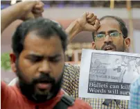  ?? — AP ?? Journalist­s shout slogans during a protest against the murder of Gauri Lankesh, in New delhi on Wednesday.