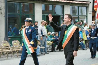  ?? CONSTANCE KRISTOFIK PHOTOS ?? The first openly gay mayor of New London, Daryl Finzio, serving as grand marshall in the city’s Irish Parade, from “Holding Space for Each Other: New London’s LGBTQ+ Community.”