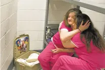  ?? DAVID GOLDMAN/ASSOCIATED PRESS ?? Inmate Crystal French, 38, left, is comforted by cellmate Krystle Sweat, 32, at the Campbell County Jail in Jacksboro, Tenn., after French was denied parole in March. She won’t be eligible again for another year. French’s two sons are being raised by...