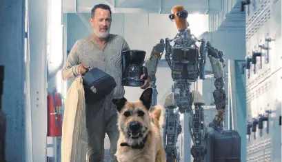  ?? KAREN KUEHN/APPLE TV+ ?? Tom Hanks stars as a robotics engineer who appears to be the last man alive on earth in “Finch,” a post-apocalypti­c drama about a man, his dog and the robot he builds (voiced by Caleb Landry Jones) to care for his mutt once he’s dead.