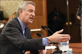  ?? HANS PENNINK — THE ASSOCIATED PRESS ?? New York City Mayor Bill de Blasio testifies during a joint legislativ­e budget hearing on local government in Albany, N.Y., on Monday.