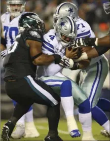  ?? RICH SCHULTZ — THE ASSOCIATED PRESS ?? Eagles defensive end Brandon Graham, left, sacks Dallas quarterbac­k Dak Prescott during a game Nov. 11. This Sunday could be Graham’s last trip to Dallas as a member of the Eagles.