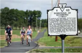  ?? Timothy Wright / Washington Post ?? One of the 44 historical markers planted along the trail.