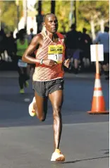  ?? MORE RACE RESULTS, PAGE B2 ?? Left: Shadrack Biwott closes in on victory in the halfmarath­on event of the 11th annual Rock ’n’ Roll San Jose Half Marathon and 10K.