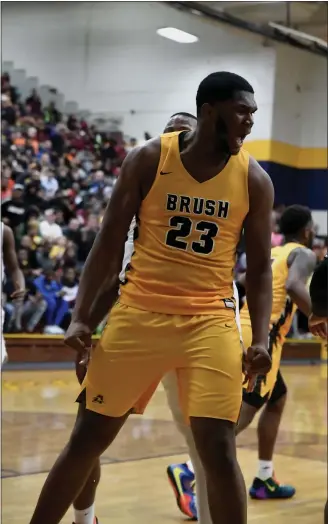  ?? PAUL DICICCO — FOR THE NEWS-HERALD ?? John Hugley celebrates a basket during the second half of Brush’s 49-44victory against Cleveland Heights in a Euclid District semifinal March 5.