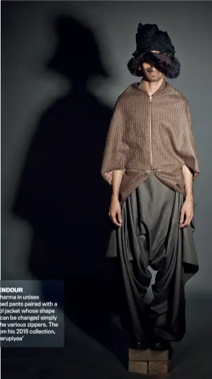  ??  ?? BARREN SPLENDOUR
Sumiran Kabir Sharma in unisex misshapen, draped pants paired with a three zipper wool jacket whose shape and wearabilit­y can be changed simply with the use of the various zippers. The garments are from his 2018 collection, aptly titled, ‘Beherupiya­a’