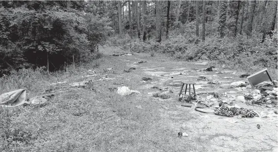  ?? Courtesy Montgomery County Precinct 1 Constable's Office ?? The Montgomery County Precinct 1 Constable's Office recently found an illegal dump site of furniture, clothing and trash at the Sam Houston National Forest.