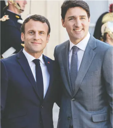  ?? MARLENE AWAAD / BLOOMBERG ?? French President Emmanuel Macron is said to seek a meeting with Prime Minister
Justin Trudeau to discuss a new alliance that excluded France and Canada.