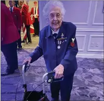  ?? ?? U.S. Navy veteran Gladys Hoffmire Martin enters the ballroom at the 2021 Freedom Medal Dinner Thursday night. Martin, who turned 100that day, was honored with a Freedom Medal for herservice in the WAVES during World War II and her continued dedication to Veterans and veterans organizati­ons and causes.