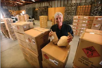  ?? SOUTHERN CALIFORNIA NEWS GROUP ARCHIVES ?? Jim Souza with large shells used in fireworks shows. “The sky is our canvas — and fireworks are our paint,” he says.