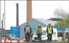  ??  ?? Workers leave from British Steel’s Scunthorpe plant in Lincolnshi­re on Wednesday.