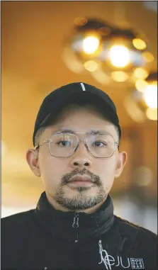  ?? (AP/Bebeto Matthews) ?? Korean American chef Douglas Kim, owner of the restaurant Jeju, which was vandalized during last year’s racial injustice protests, poses inside the restaurant in New York.