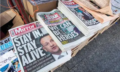  ?? Photograph: Paul Faith/AFP via Getty Images ?? Caretaker taoiseach Leo Varadkar on the front pages of Irish national newspapers on Wednesday.