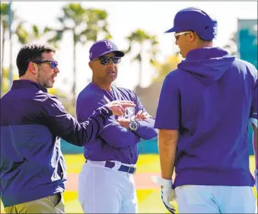  ?? Kent Nishimura Los Angeles Times ?? DODGERS BASEBALL OPERATIONS boss Andrew Friedman, left, with manager Dave Roberts and outfielder Joc Pederson, says the club “wanted to help” by paying minor leaguers full stipends during shutdown.