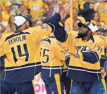  ?? CHRISTOPHE­R HANEWINCKE­L, USA TODAY SPORTS ?? Defensemen Mattias Ekholm and P.K. Subban high-five after the Predators clinched a spot in the Stanley Cup Final on Monday by ousting the Ducks in Game 6.