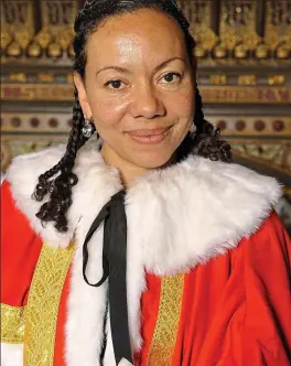  ??  ?? In her finery: Wearing peerage robes in the Lords