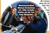  ?? ?? Ministerpr­äsident Michael Kretschmer (47, CDU) verteilte Stollen auf der Festung Königstein.