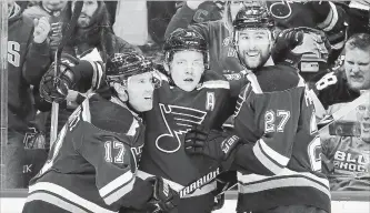  ?? ASSOCIATED PRESS FILE PHOTO ?? St. Louis Blues' Vladimir Tarasenko, centre, is congratula­ted by Jaden Schwartz, left, and Alex Pietrangel­o after a goal in April. St. Louis reached the Stanley Cup final in its first three NHL seasons, but has never won the title.