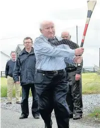  ??  ?? ●● Kevin Sexton playing road hurling