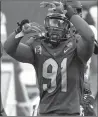  ?? MATT FREED/AP ?? Pittsburgh’s Patrick Jones II celebrates a sack of Louisville’s Malik Cunningham on Saturday.