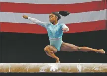  ?? ELISE AMENDOLA/ASSOCIATED PRESS ?? Simone Biles competes on the balance beam at the U.S. Gymnastics Championsh­ips on Sunday in Boston.