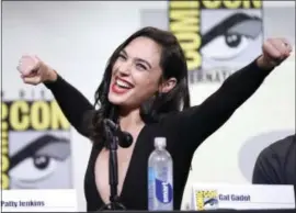  ??  ?? In this July 23 photo, Gal Gadot makes a Wonder Woman pose at the “Wonder Woman” panel on day 3 of Comic-Con Internatio­nal in San Diego.