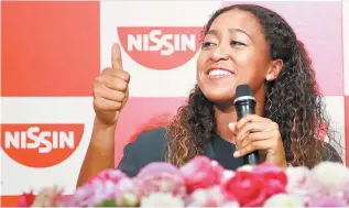  ?? Reuters-Yonhap ?? Naomi Osaka attends a news conference in Yokohama, Thursday, upon her arrival in Japan, after winning the 2018 U.S. Open women’s singles finals tennis match.