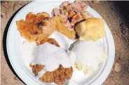  ??  ?? Chicken-fried steak, potatoes, beans, breads or rolls and dessert are the dishes prepared by chuck wagon cooks during competitio­ns.