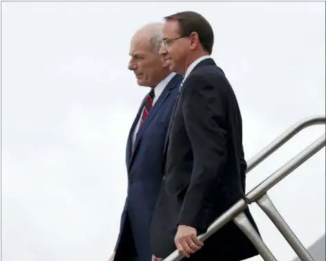  ?? ALEX BRANDON — THE ASSOCIATED PRESS ?? White House Chief of Staff John Kelly and Deputy Attorney General Rod Rosenstein step off Air Force One, Monday in Orlando, Fla.