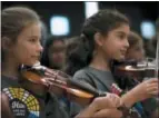  ?? KEVIN VIOL — OLD TOWN SCHOOL OF FOLK MUSIC VIA AP ?? This 2016 photo provided by Old Town School of Folk Music shows students participat­ing in one of Old Town School’s summer fiddle camp programs in Chicago, Ill.