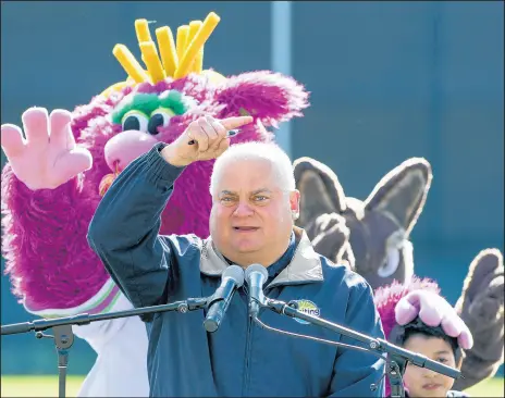  ?? MARK DAVIS/POST-TRIBUNE ?? Mayor Joe Stahura speaks at the Oil City Stadium while Reggy (the mascot) has some fun in the background in 2016.