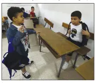  ?? (File Photo/AP/Fateh Guidoum) ?? Schoolchil­dren arrive in their classroom Sept. 21, 2022, at a private school in Birkhadem.