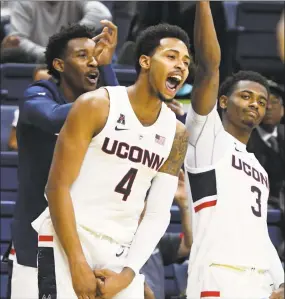  ?? Associated Press ?? UConn guard Jalen Adams (4) celebrates after hitting a 3-pointer against Southern Connecticu­t during an exhibition win on Nov. 2 in Storrs.