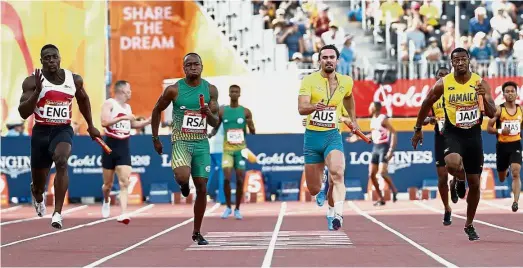  ??  ?? Pushing all the way: England’s Harry AikinesAry­eetey leading (from left) South Africa’s Akani Simbine, Australia’s Josh Clarke and Jamaica’s Yohan Blake to win the men’s 4x100m relay at the Carrara Stadium yesterday. — AP