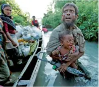  ?? Reuters file ?? Rohingya refugees arrive at the Bangladesh­i side of the Naf River after crossing the border from Myanmar, in Palang Khali, Bangladesh. —