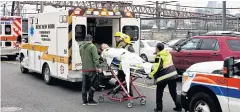  ?? NYT ?? A victim is loaded into an ambulance near the Hoboken Terminal where a commuter train crashed into a station in New Jersey during Thursday morning rush hour.