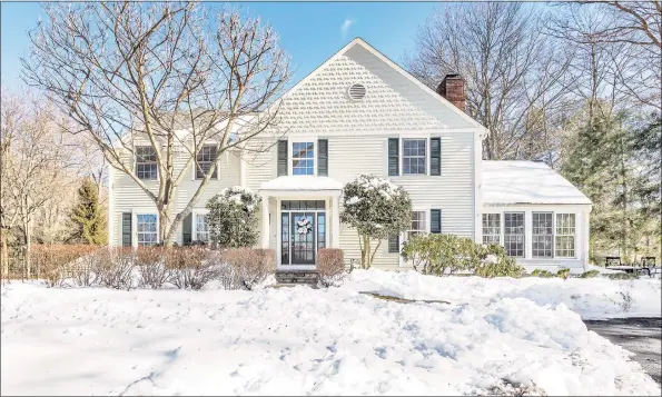  ?? Contribute­d photos ?? This beautifull­y renovated colonial features a culinary- inspired gourmet kitchen, sunroom with heated floor, and a grand family room.