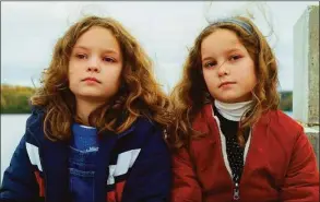 ?? Lilies Films/Neon ?? Joséphine Sanz, left, and Gabrielle Sanz in “Petite Maman.”