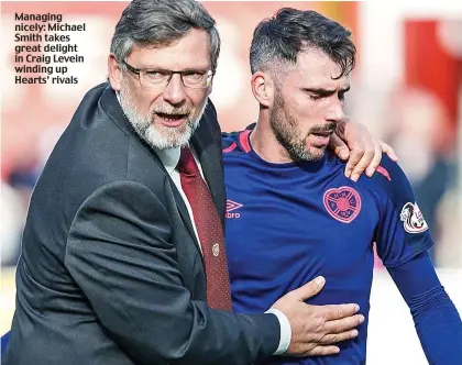  ??  ?? Managing nicely: Michael Smith takes great delight in Craig Levein winding up Hearts’ rivals