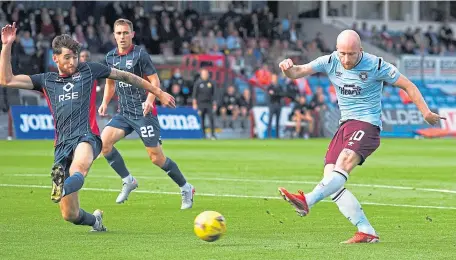  ??  ?? Hearts’ Liam Boyce opens the scoring with a low finish