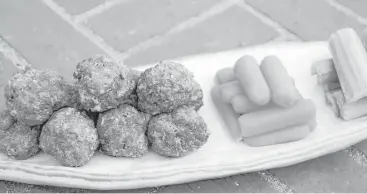  ?? Melissa d’Arabian / Associated Press ?? Use an ice cream scoop to form these Buffalo-Style Meatballs.