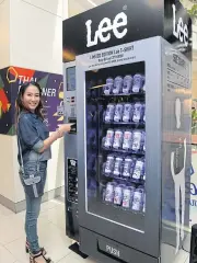  ??  ?? Consumers can now buy Lee T-shirts from vending machines in selected locations, with jeans to be added next year. Central Marketing Group plans to boost the number of machines to 200 in three years from four at present.