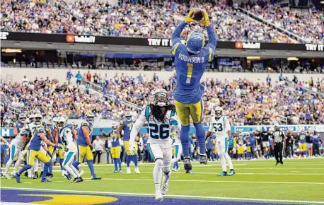  ?? Ashley Landis/Associated Press ?? Los Angeles Rams wide receiver Allen Robinson II (1) makes a touchdown catch over Carolina Panthers cornerback Donte Jackson (26) during the first half on Oct. 16 in Inglewood, Calif. Robinson.