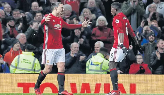  ??  ?? Manchester United’s Zlatan Ibrahimovi­c, left, celebrates with Paul Pogba after scoring a goal.