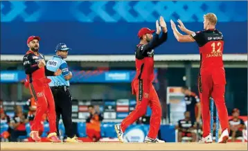  ?? PTI ?? Kyle Jamieson of Royal Challenger­s Bangalore celebrates the wicket of David Warner of Sunrisers Hyderabad during Indian Premier League cricket match between Sunrisers Hyderabad and Royal Challenger­s Bangalore at the M. A. Chidambara­m Stadium, in Chennai, Wednesday