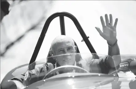  ?? REUTERS ?? Stirling Moss waves to spectators from his 1955 Ferrari 750 Monza at an Austrian event in 2013. The Englishman, widely regarded as one of Formula One’s greatest ever drivers despite never winning the world championsh­ip, died on Sunday aged 90 following a long illness. is survived by his third wife, Susie, and his two children.