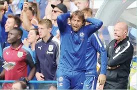  ??  ?? Antonio Conte agonises on the touchline as Chelsea miss a chance to equalise with the final attack of a frantic match