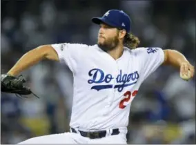  ?? MARK J. TERRILL — THE ASSOCIATED PRESS ?? Los Angeles Dodgers starting pitcher Clayton Kershaw throws to an Arizona Diamondbac­ks batter during first inning of Game 1of a baseball National League Division Series in Los Angeles, Friday.