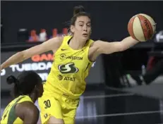  ?? Associated Press ?? Seattle’s Breanna Stewart saves the ball from going out of bounds. She led the Storm in their Game 2 win with 22 points.